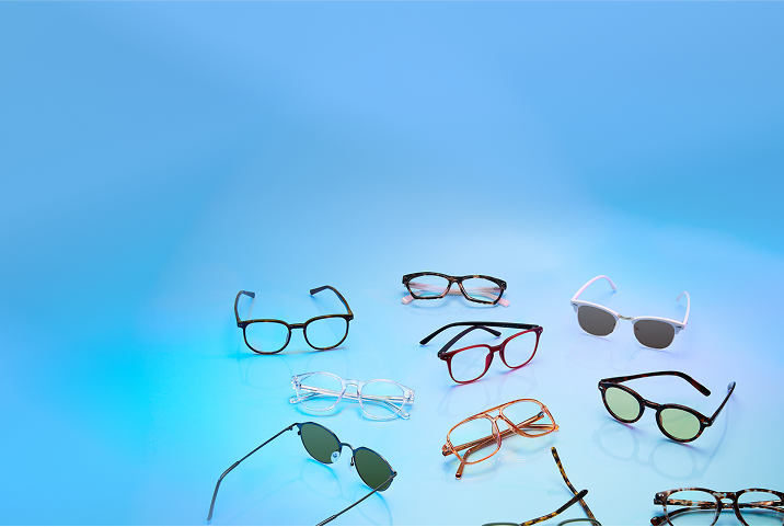 A variety of eyeglasses and sunglasses arranged in a circular layout on a glowing blue background