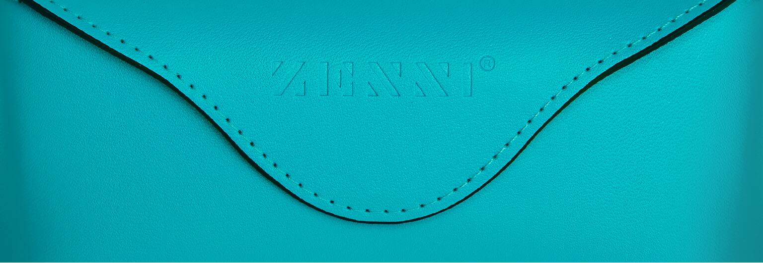 Deluxe teal case with embossed Zenni logo.