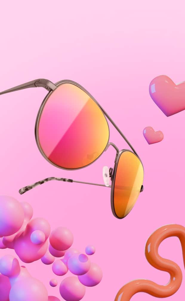 Classic metal aviator sunglasses with vibrant orange and pink gradient mirrored lenses floating in a playful 3D scene with pink hearts, glossy bubbles, and a flamingo accent against a bright pink background.
