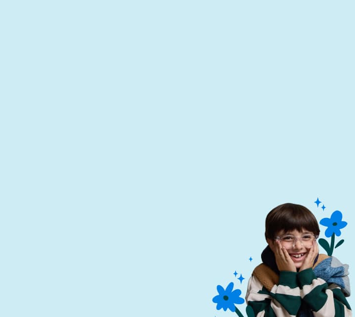 A child in striped sweater and a red-haired adult in glasses smile together against a light blue background with flower illustrations.