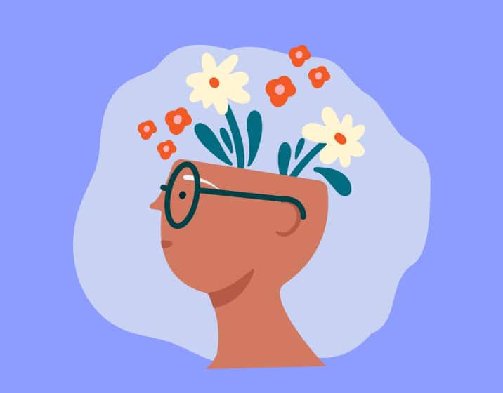 A profile illustration of a person wearing round glasses, whose open head is filled with blooming white and orange flowers, set against a purple background.