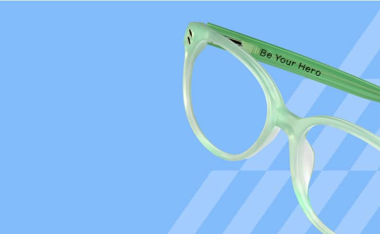 Mint green frames engraved with 'Be Your Hero,' part of Zenni’s Vision of Wellness collection, designed to inspire confidence and support mental health awareness.