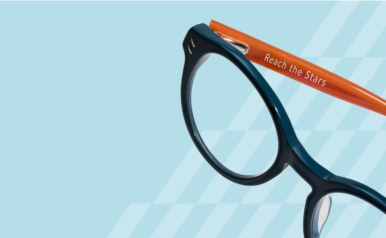 Blue frames with orange temples engraved with 'Reach the Stars,' part of Zenni’s Vision of Wellness collection, designed to empower and inspire confidence.