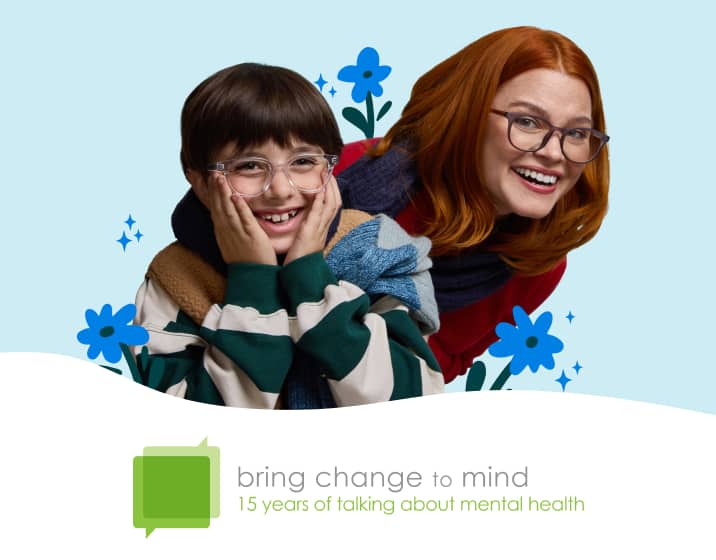 A boy with dark hair wearing clear round Zenni glasses and a woman with red hair wearing brown square Zenni glasses, surrounded by illustrations of blue flowers, on a pale teal background. Image also features the Bring Change to Mind logo (two overlapping speech bubbles with the organization name inside), with the tagline: “15 years of talking about mental health.”