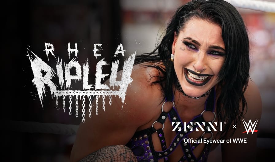 The Rhea Ripley logo (pen-stroke style lettering over a row of dangling chains) over a large picture of Rhea Ripley in a wrestling ring wearing black leather wrestling attire.