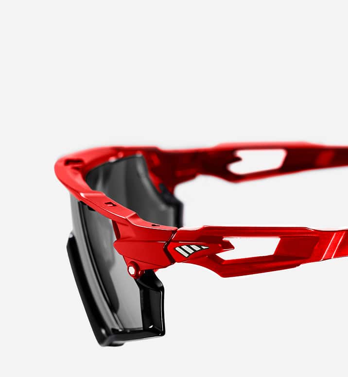 Red sports sunglasses with a ventilated temple design to promote airflow and reduce fog.