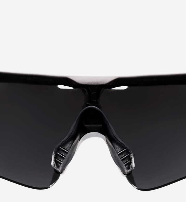 Close-up of adjustable nose pads on sports sunglasses providing a personalized fit and reducing slippage.