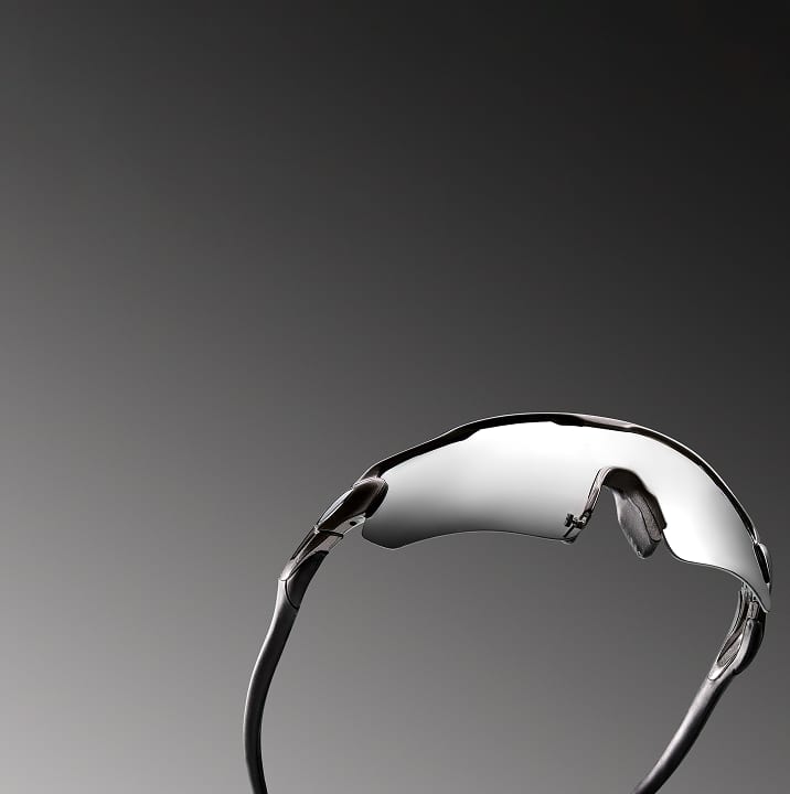 Sunglasses under the title 'Active Lifestyle.' Description reads: 'Ideal for outdoors. Polarized high-wrap lenses, lightweight frames, rubberized temple tips and nose pads, and 100% UV protection.' Below is a 'Shop now' button. The style number T01022142 is listed at the bottom right.