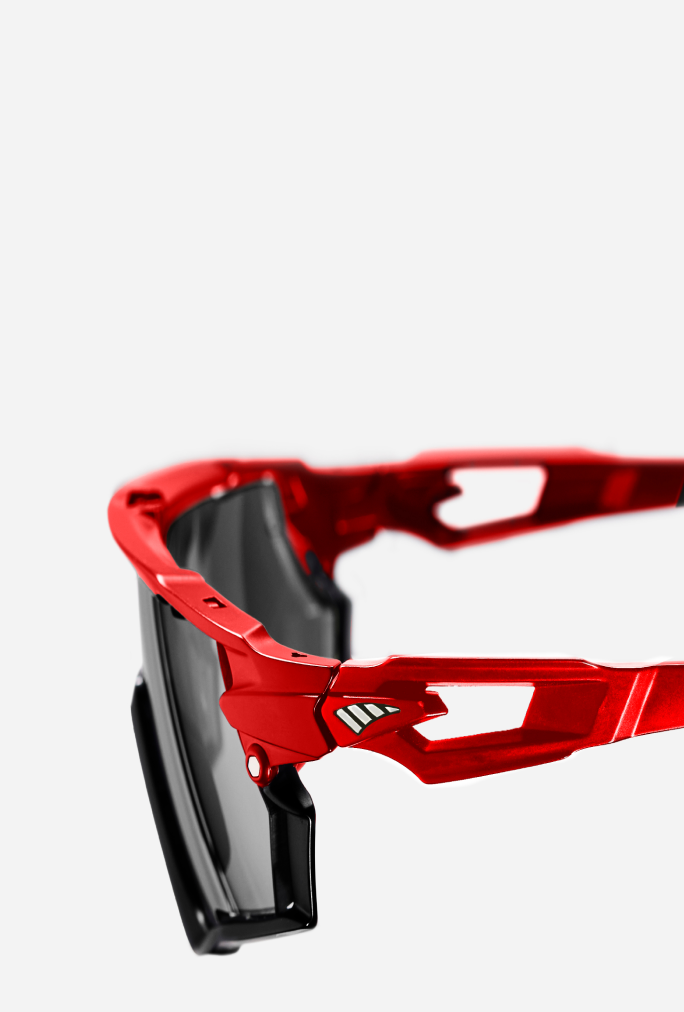 Red sports sunglasses with a ventilated temple design to promote airflow and reduce fog.