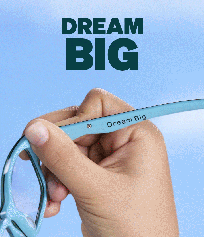 A GIF showing two images: first, a hand holding light blue eyeglasses displaying the inner temple engraved with Dream Big against a sky background with bold text reading DREAM BIG above; second, a smiling girl with pigtails wearing clear eyeglasses playing with her hair against a blue sky background with bold text reading DREAM BIG above.