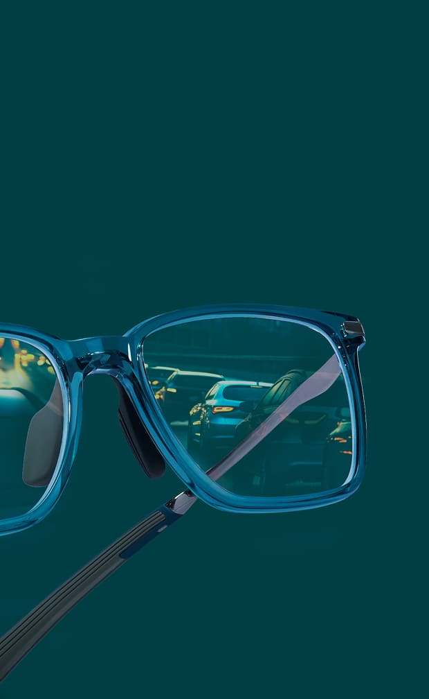 Zenni blue eyeglasses with night driving lenses on a dark teal background.