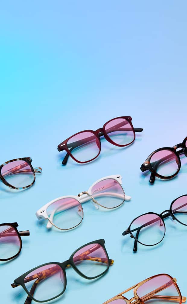 Array of Zenni glasses with Zenni ID Guard pink-sheen lenses on a blue background.