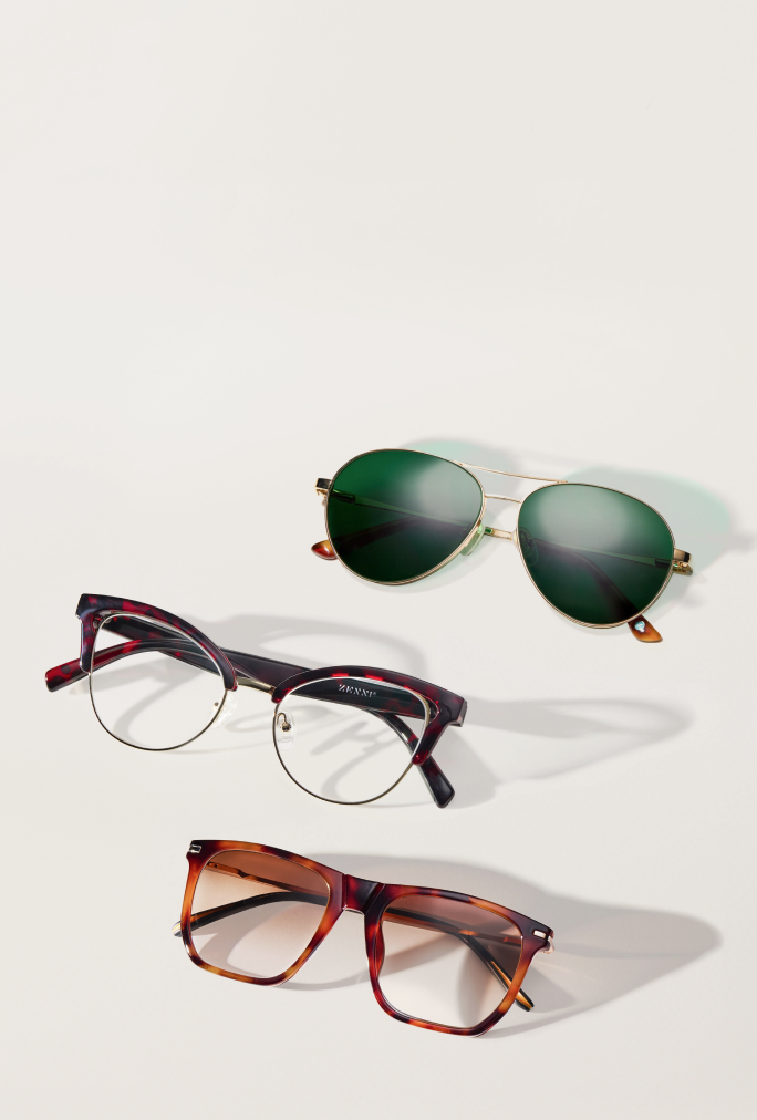 Three pairs of Zenni glasses - cat-eye frames, aviator sunglasses, and rectangular frames against a neutral background.