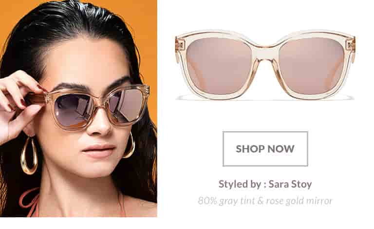 Model styled by Sara Stoy wearing premium square sunglasses #1116222 in translucent amber with 80% gray tint and rose gold mirror finish.