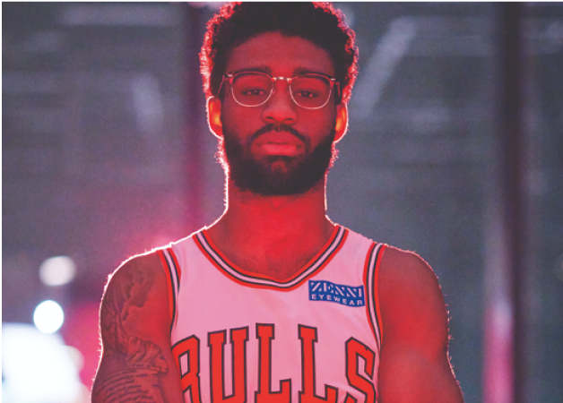 Coby White wearing his Chicago Bulls jersey and Zenni browline glasses.