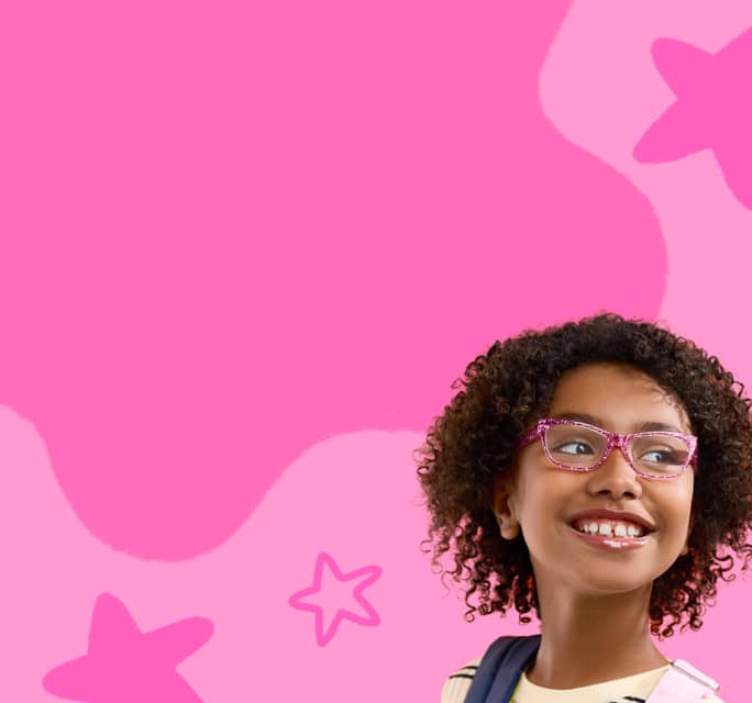 Close-up of a smiling young girl with curly dark hair looking to the side while wearing sparkly pink rectangular eyeglasses, set against a vibrant pink background with abstract star doodles.
