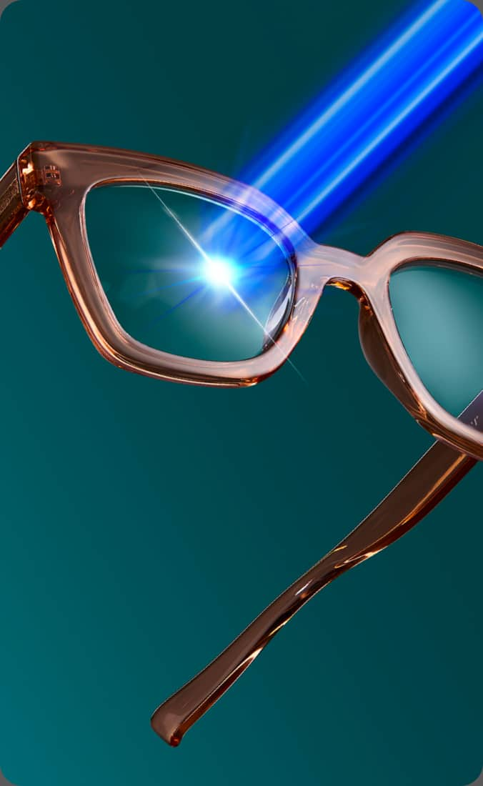 Close-up of amber-colored eyeglasses with a blue light beam hitting the lens, emphasizing blue light filtering. The background is a teal gradient. Text bubbles highlight the features: 'Filters 16x More Blue Light', '100% UV protection', 'Anti-reflective', and 'Anti-scratch'.