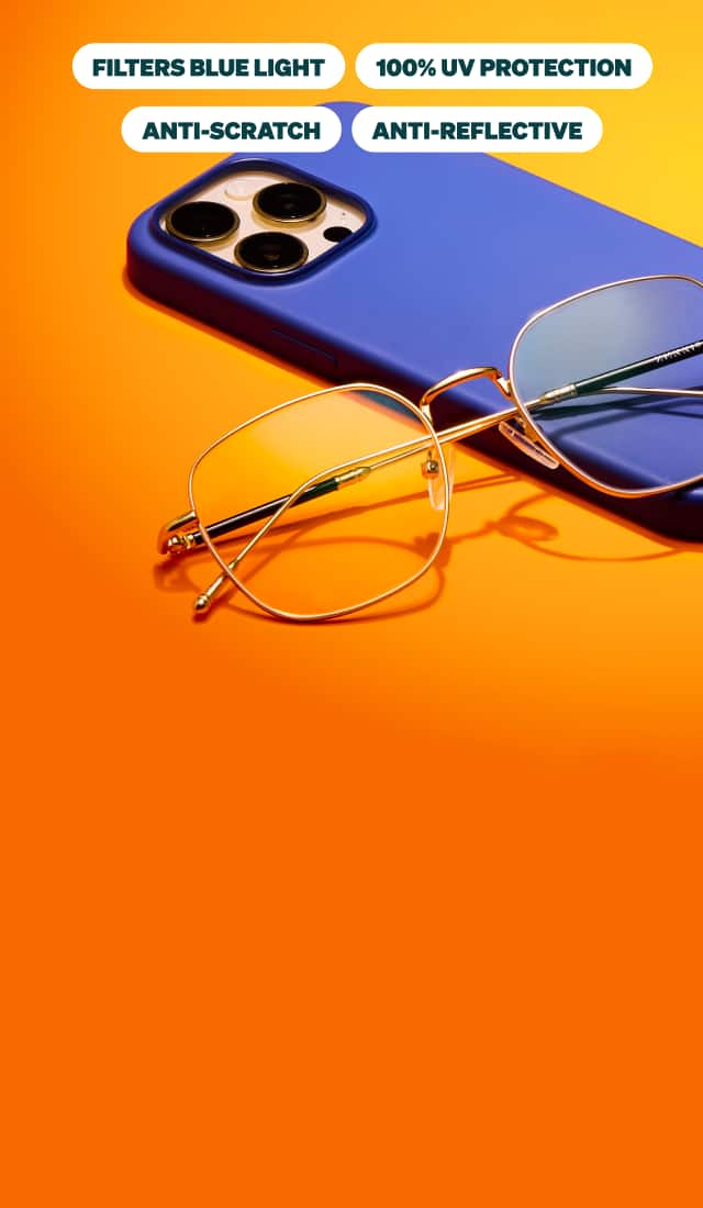 Gold-framed blue light glasses on a blue phone against an orange background, with labels highlighting their features: blue light filtering, UV protection, anti-scratch, and anti-reflective.