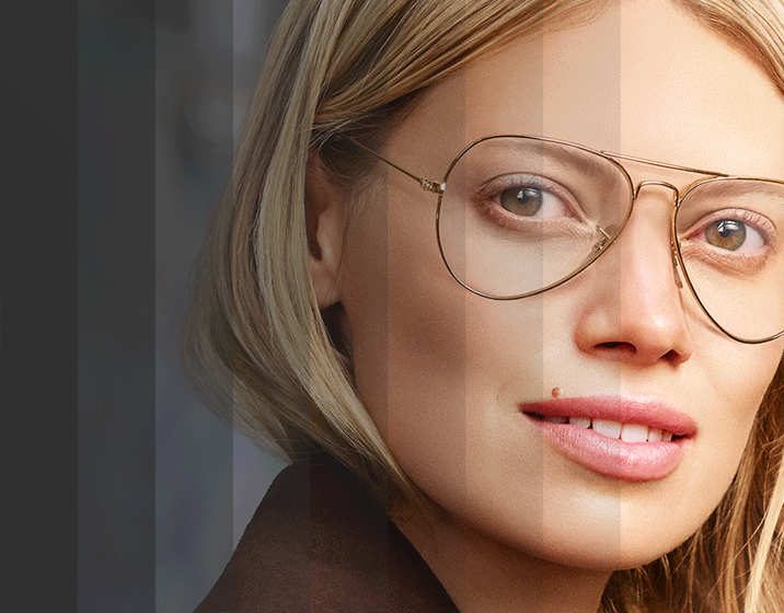 Image of a woman wearing Transitions® glasses.