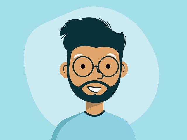 A man with tan skin and round glasses, with a beard and a trendy haircut, on a light blue background.