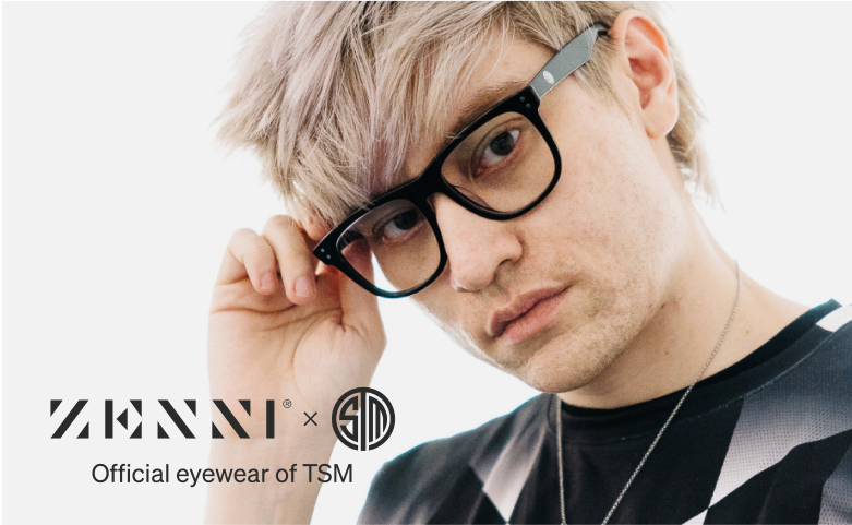 Leffen wears black-framed Zenni TSM glasses, holding the frame with one hand against a white background.