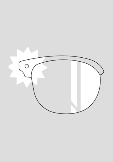 Sketch of a glasses lens with a symbol of the sun in front of it.