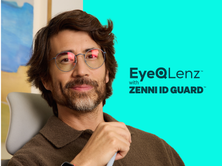 The image features a person with medium-length dark hair and a beard, wearing glasses with red-tinted lenses. They are seated in a grey chair, wearing a brown collared shirt. The background consists of a light blue wall and a partially visible abstract painting with blue and brown tones. To the right, text 'EyeQ Lenz with Zenni ID Guard' on a turquoise background.