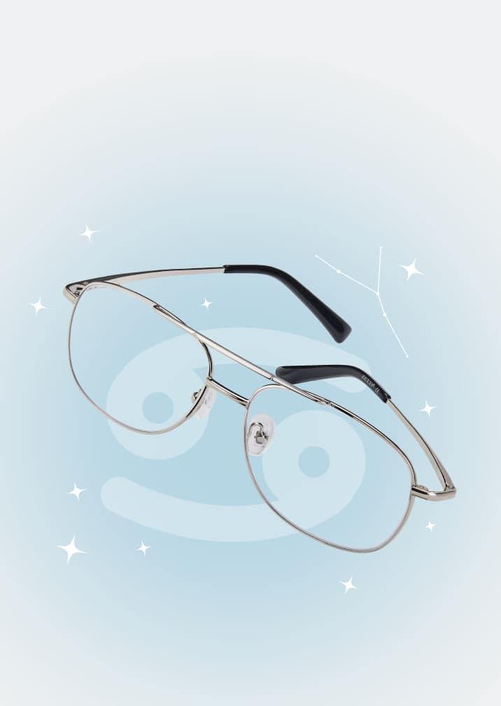 Silver aviator-style glasses on a soft blue zodiac background with the Cancer symbol and constellation.