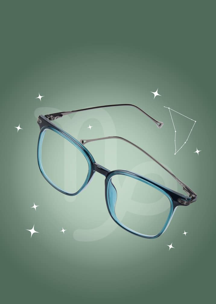 Blue and black square eyeglasses on a forest green zodiac background with the Capricorn symbol and constellation.