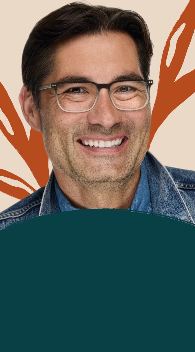 Smiling man wearing gradient rectangular eyeglasses against a dark teal background with orange leaf illustrations.
