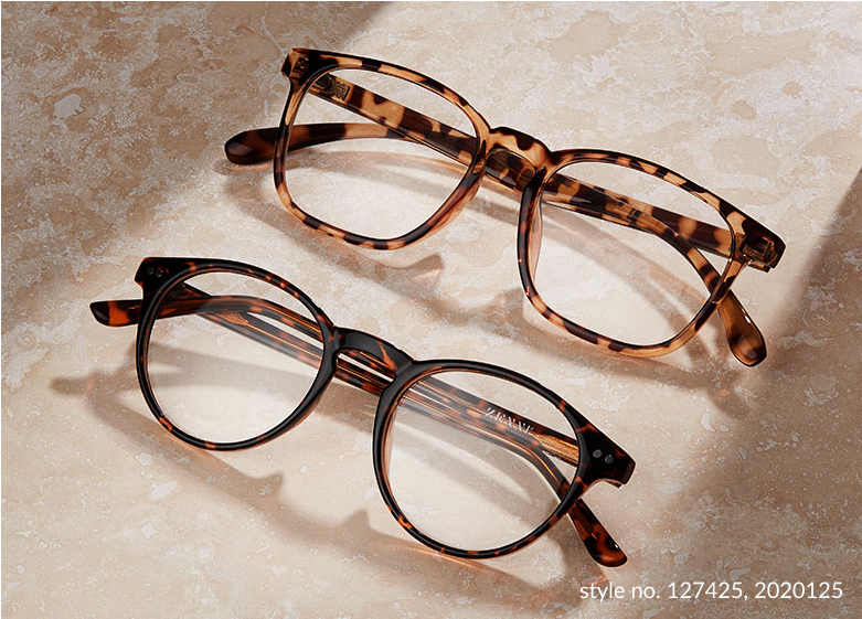 2 tortoishell style glasses on a cream marble background.