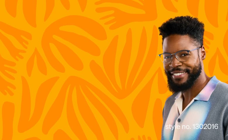 A man wearing blue browline eyeglasses and a gradient pastel shirt stands in front of a bright orange background with abstract hand and leaf shapes.