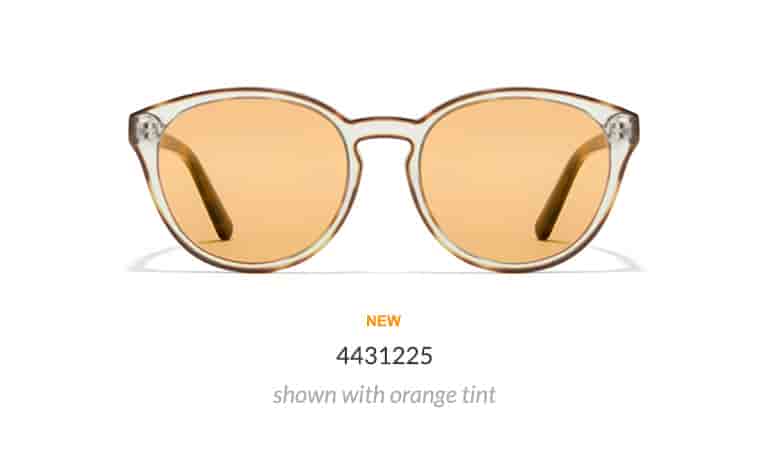 These round glasses are clear with an opaque outline, creating a striking effect. Shown in tortoiseshell with orange fashion tint.