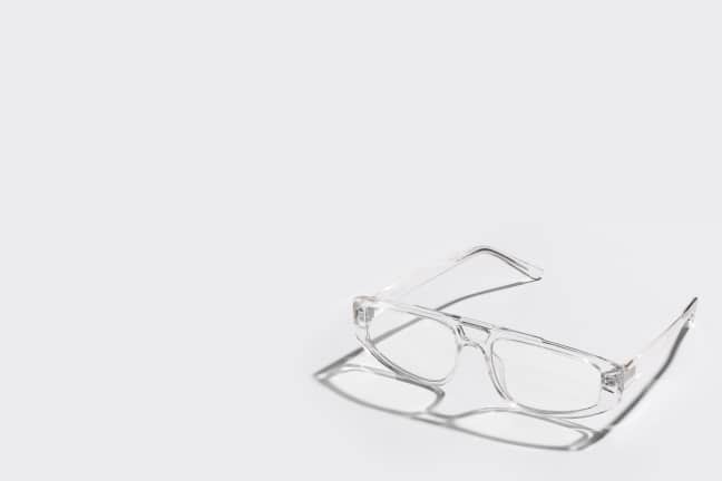 Clear rectangular blue-light blocking glasses for gamers shown on a white background with a caption "Blue-Light Protection: Fashion meets function for gamers."