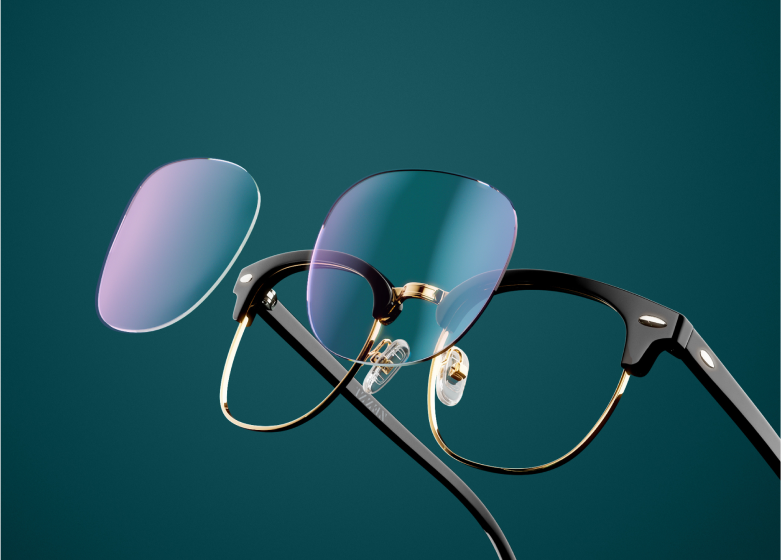 Black half-frame glasses with removable blue-tinted lenses on a dark green background.