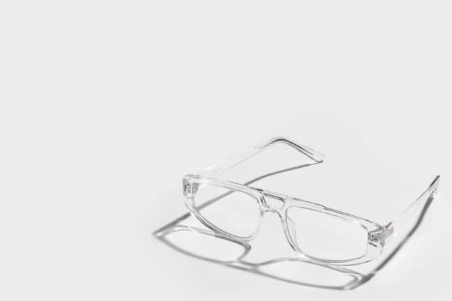 Clear rectangular blue-light blocking glasses for gamers shown on a white background with a caption "Blue-Light Protection: Fashion meets function for gamers."