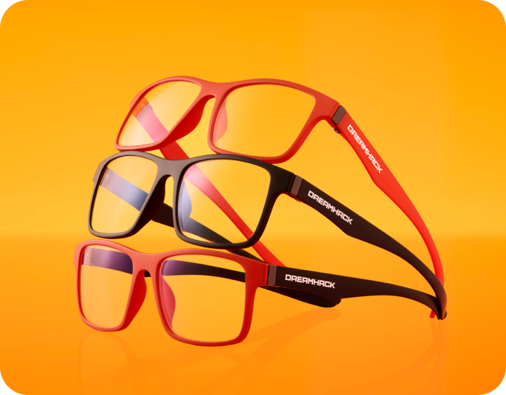 Three pairs of Dreamhack X Zenni glasses in dark orange and black frames, stacked on top of each other on orange background.