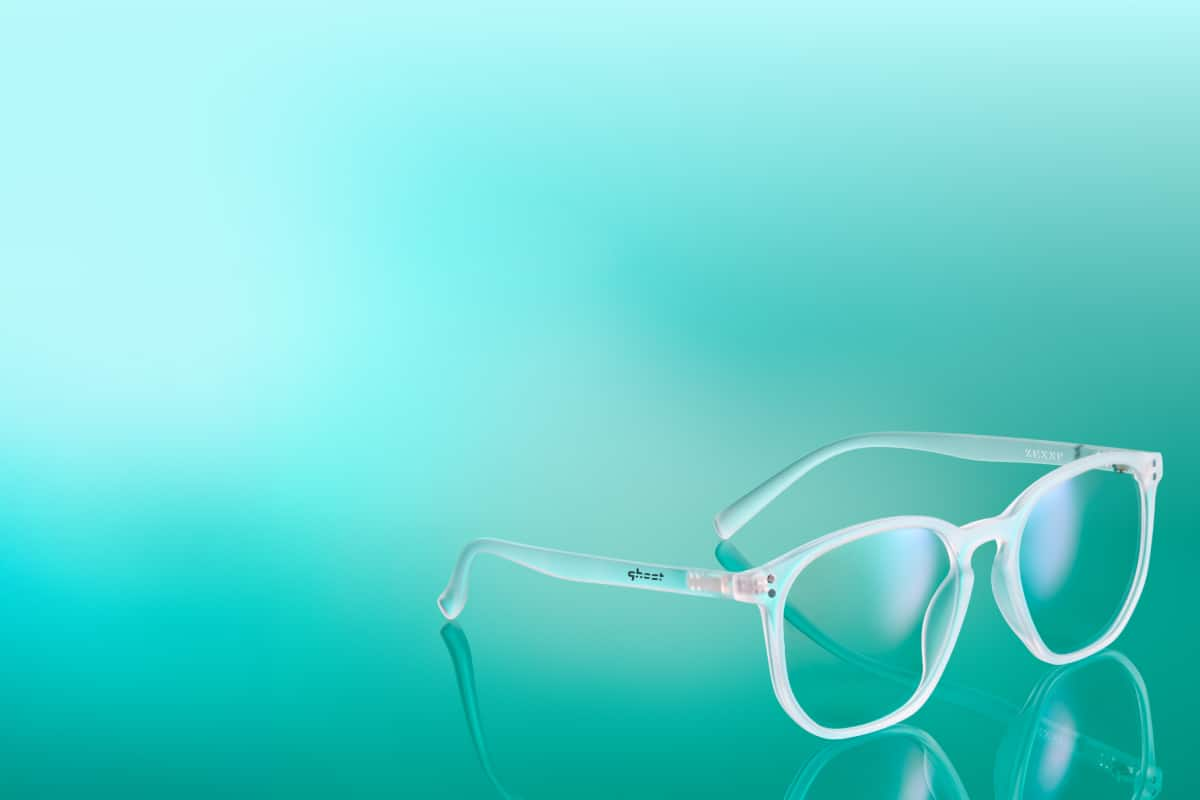 Light blue eyeglasses with clear lenses from “The Ghost Collection” promoted with the text “Shop glasses selected by Ghost Gaming and create your custom glasses build.”, and a “Shop now” button.