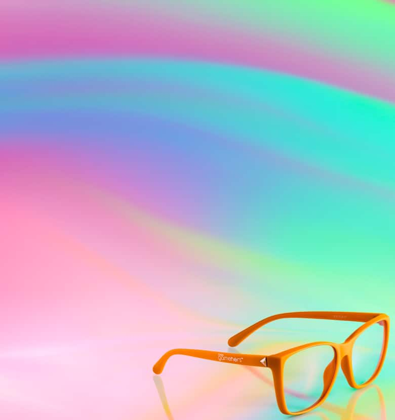 Zenni x the*gameHERS promotional banner featuring the official eyewear collection with orange glasses displayed on a colorful gradient background.