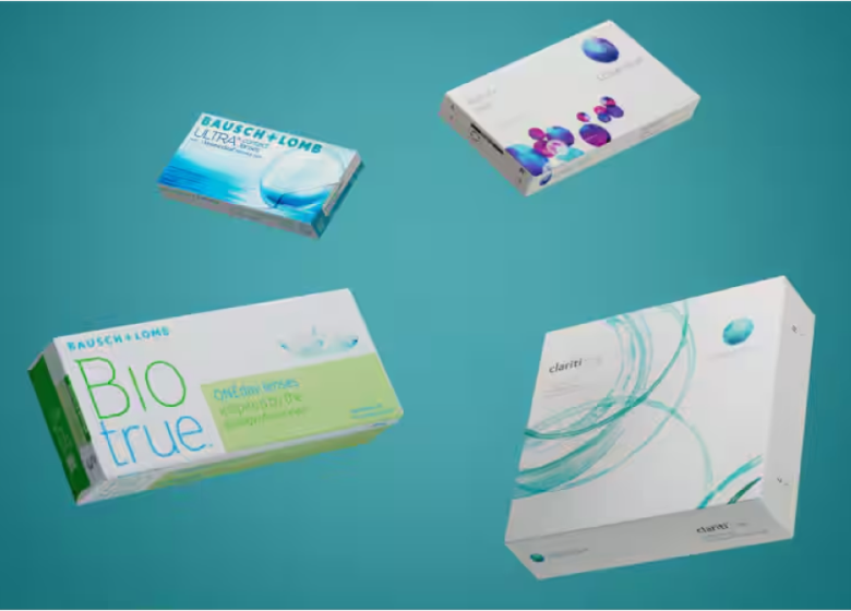 Four different contact lens packages against a blue background. Top-left: Bausch + Lomb LUMIFY box with a blue design. Top-right: Contact lens box with colorful geometric design. Bottom-left: Bausch + Lomb Biotrue contact lens solution box with green and white design. Bottom-right: Contact lens box with swirling blue patterns and text pointing towards it.