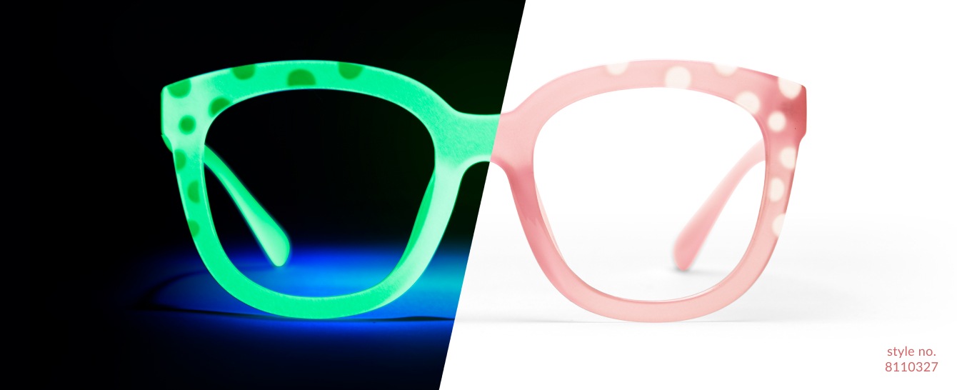 Image of Zenni glow-in-the-dark glasses #8110327, split in half; one side is dark and glowing bright green with polka dots, while the other side is light and pink.