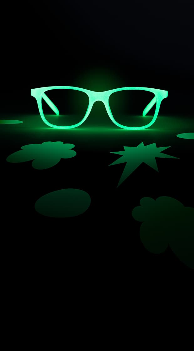 The image shows glowing green rectangular glasses centered against a dark background. Surrounding them are abstract green shapes, including an ellipse, a clover-like form, and a starburst, creating a striking contrast.