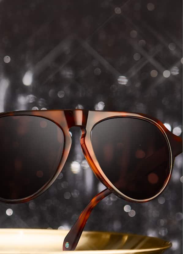 Zenni tortoiseshell sunglasses on festive holiday silver tinsel background