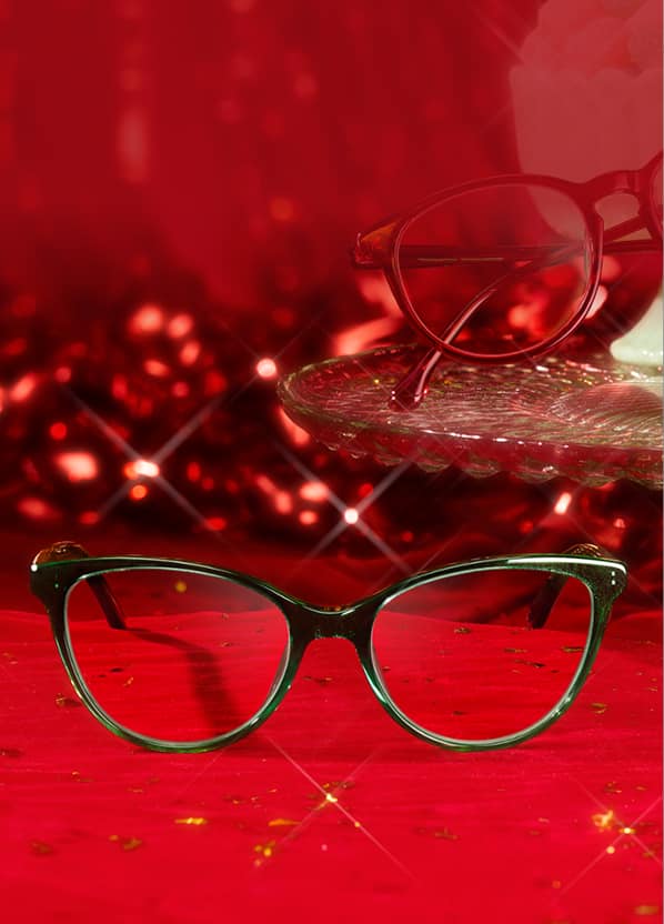 Zenni cat-eye glasses on red background with sparkle effects