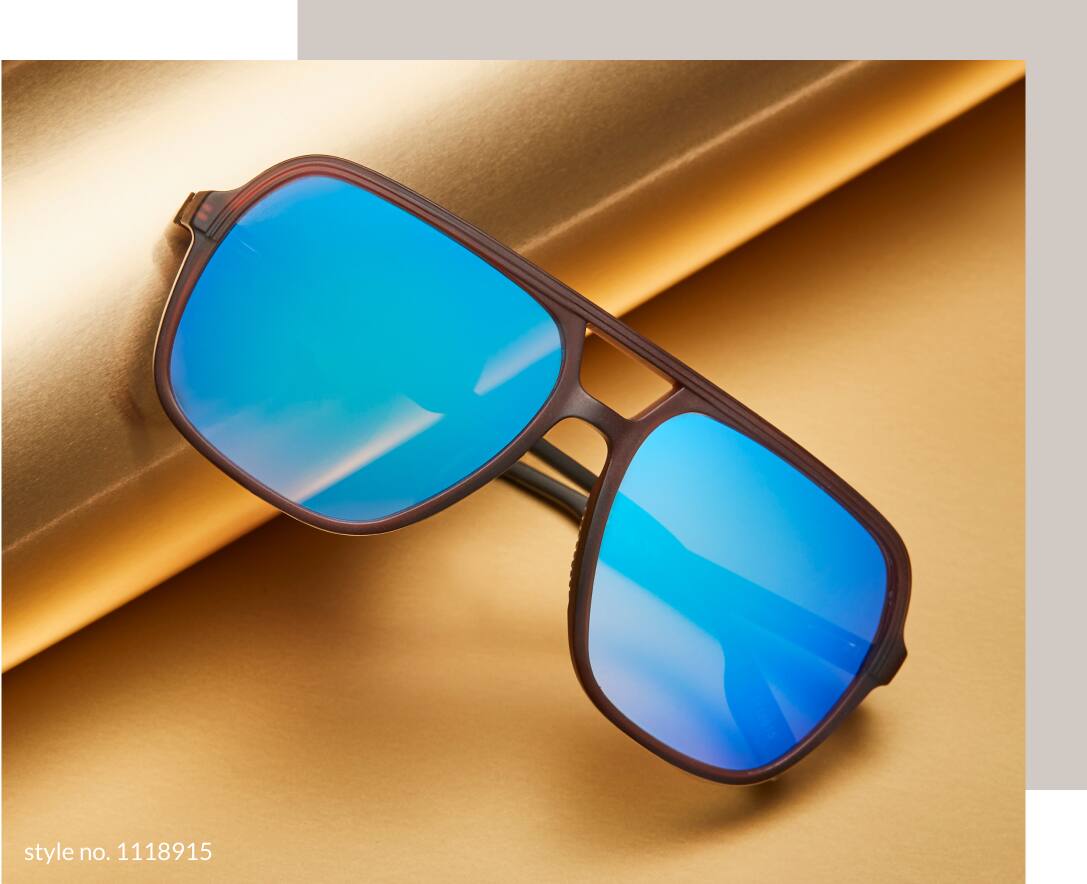 Image of a pair of Zenni premium aviator sunglasses #1118915, resting against a roll of gold wrapping paper on a gold background.