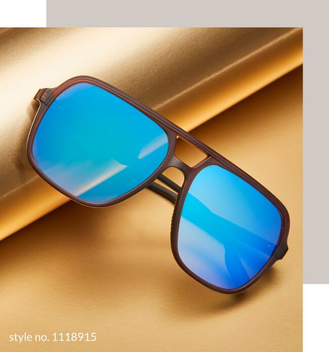 Image of a pair of Zenni premium aviator sunglasses #1118915, resting against a roll of gold wrapping paper on a gold background.