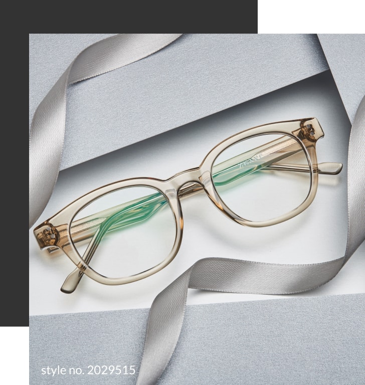 Image of Zenni square glasses #2029515, on a beige background, surrounded by gray wrapping paper and ribbon.