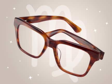A pair of tortoiseshell square eyeglasses floats against a soft beige background with white sparkles, the Virgo zodiac symbol, and a constellation outline.