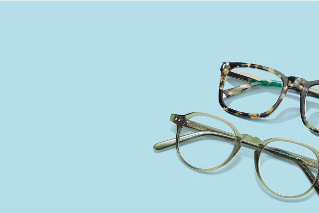 2 pairs of patterned glasses on a dark green solid background.