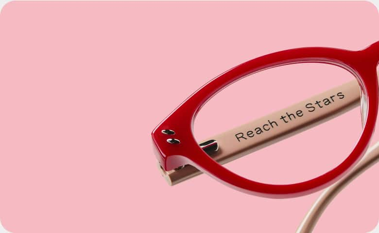 Red frames engraved with 'Reach the Stars,' part of Zenni’s Vision of Wellness collection, designed to inspire confidence and support mental health awareness.